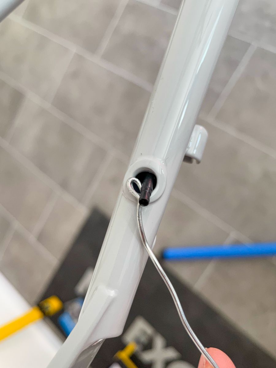 A bent steel wire catch a Di2 wire plug and pulling it out of the bicycle frame