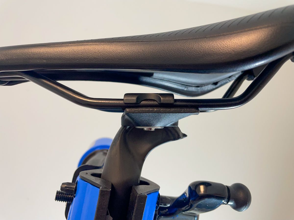 A close image of the saddle mounted to the Ritchey Link seatpost clamp